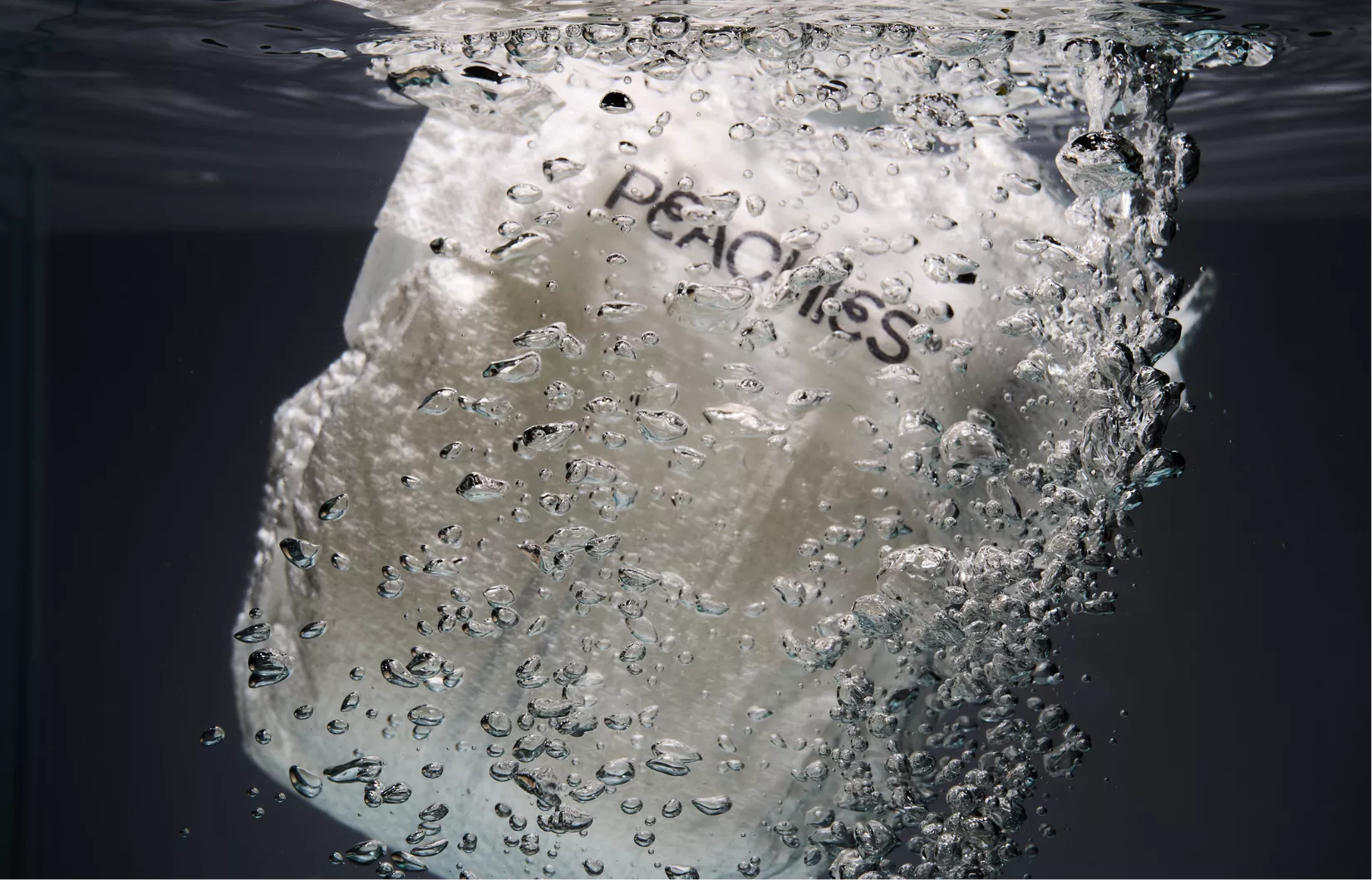 Peachies nappy photographed beneath water with bubbles